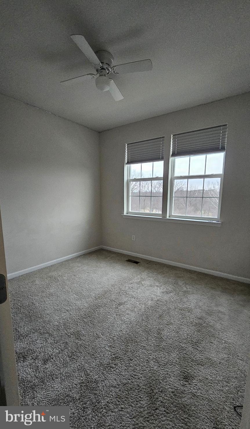 5147 Constitution Street Frederick, MD 21703 - Photo 16 of 23 an empty room with a empty space and windows
