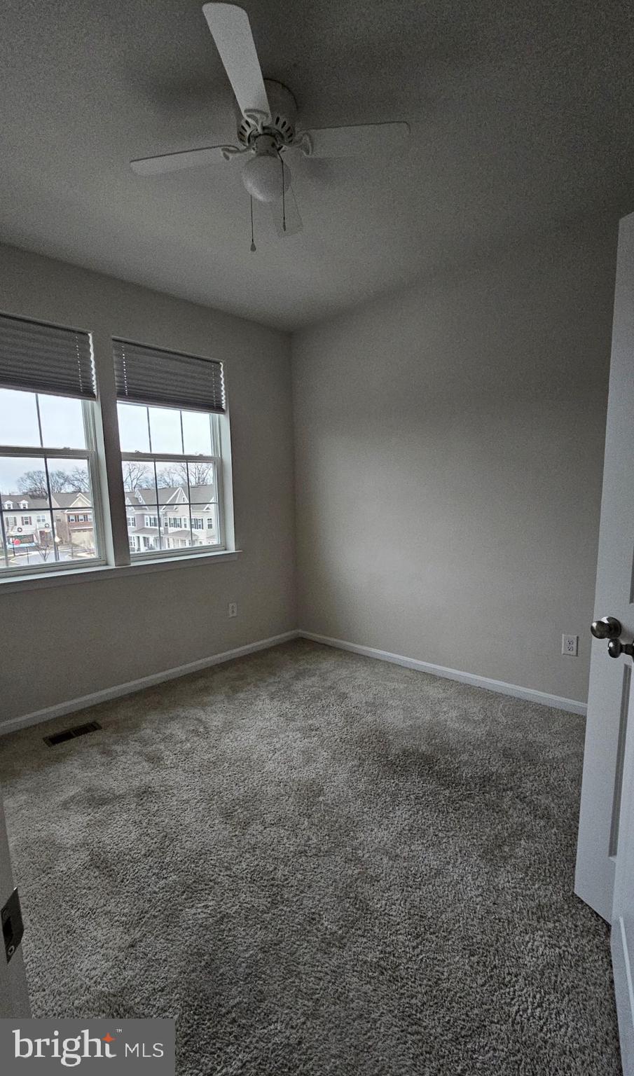 5147 Constitution Street Frederick, MD 21703 - Photo 18 of 23 an empty room with a empty space and windows
