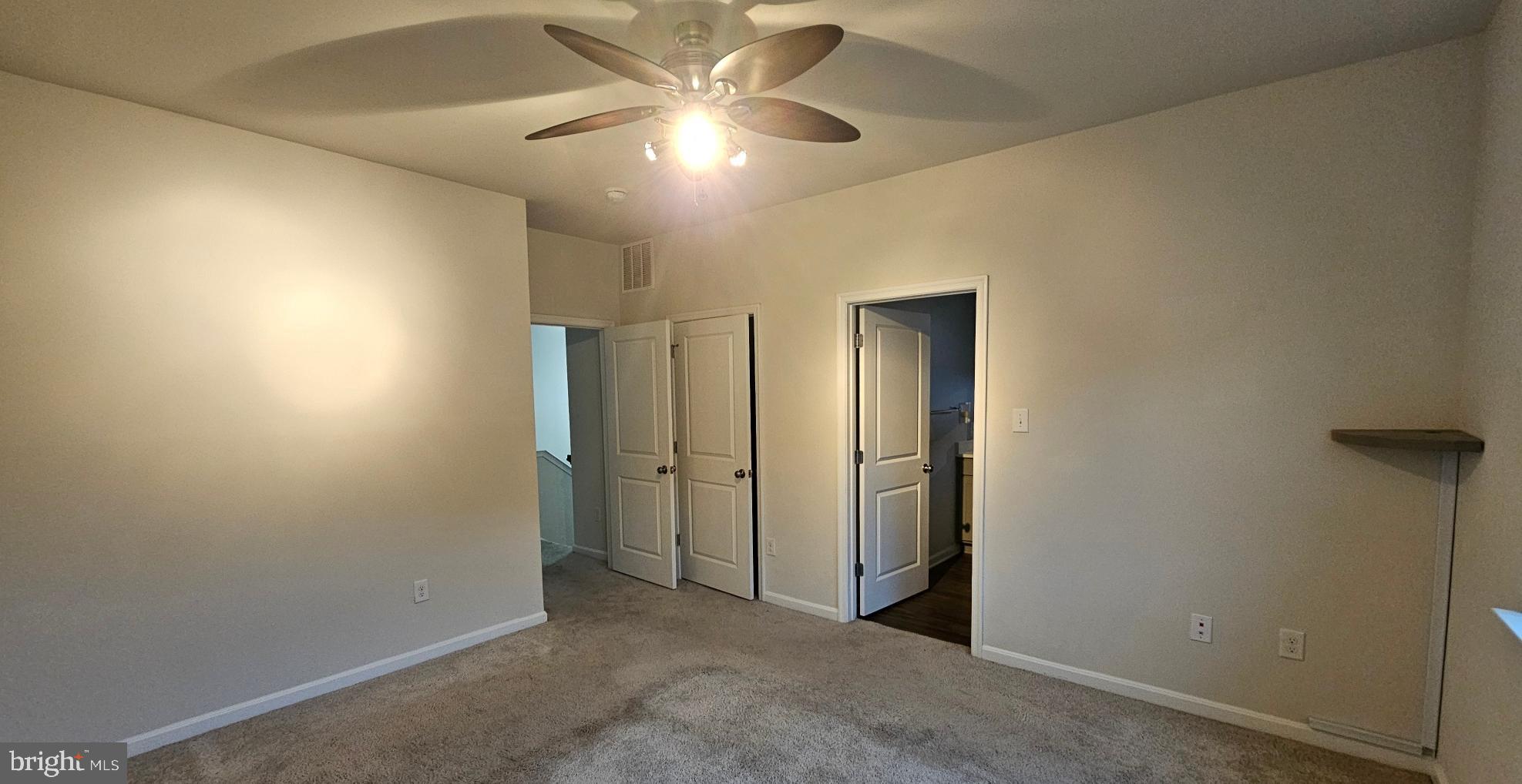 5147 Constitution Street Frederick, MD 21703 - Photo 19 of 23 an empty room with closet and a chandelier fan