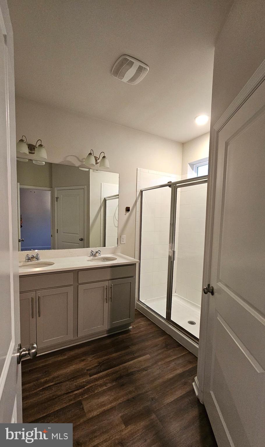 5147 Constitution Street Frederick, MD 21703 - Photo 21 of 23 a bathroom with a double vanity sink and mirror