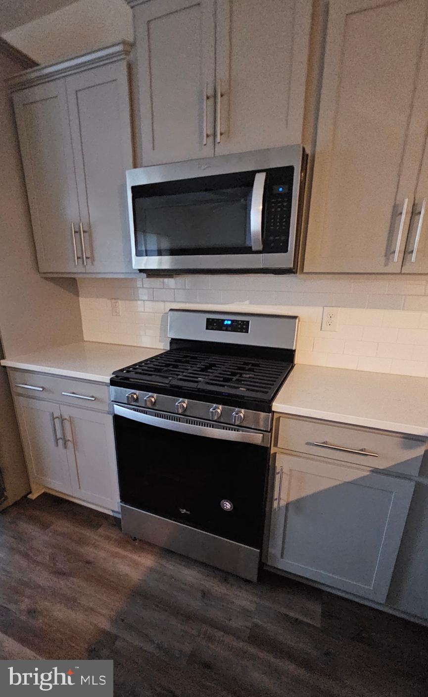 5147 Constitution Street Frederick, MD 21703 - Photo 7 of 23 a stove top oven sitting inside of a kitchen