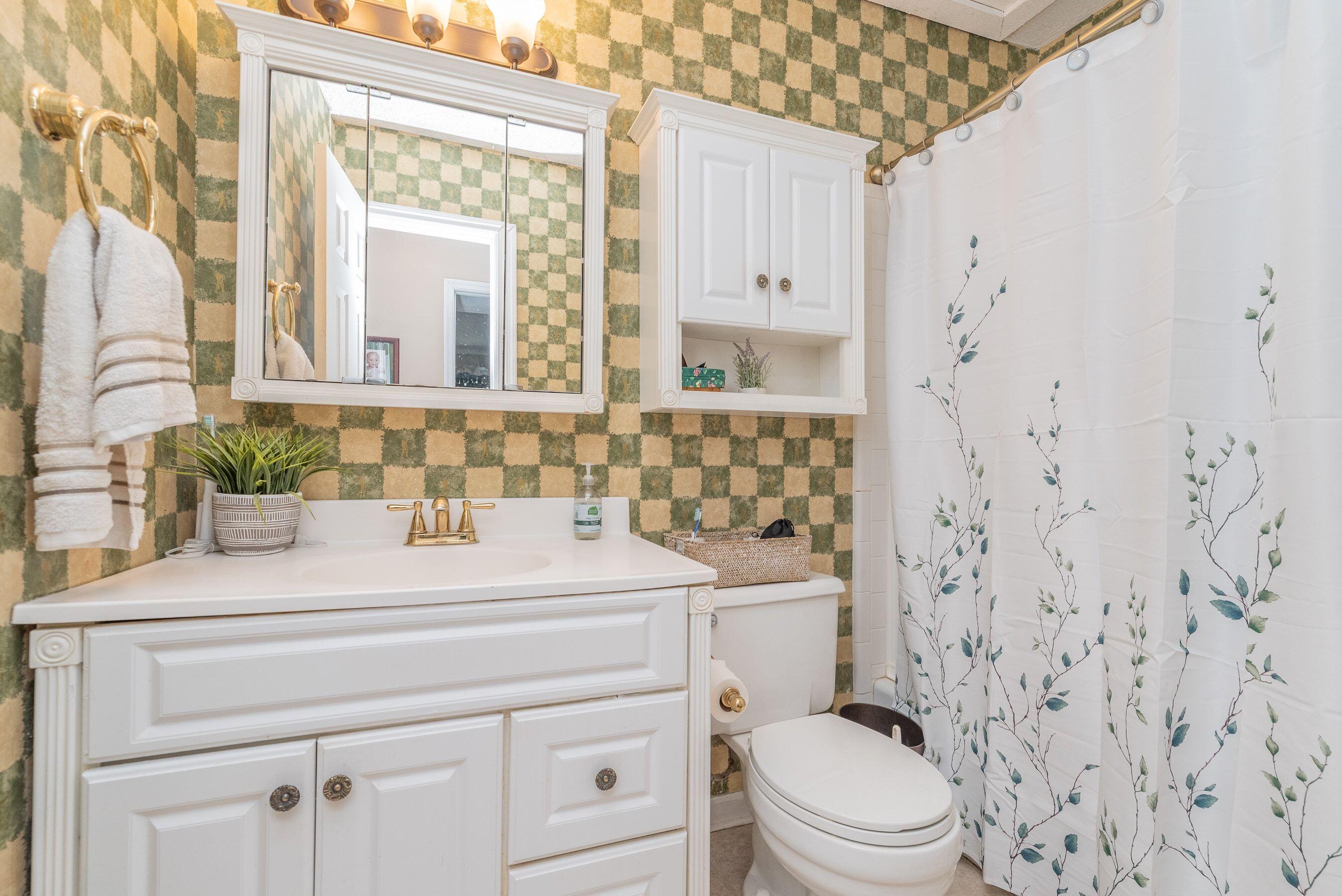 1117 Ridgemont Drive Aiken, SC 29803 - Photo 28 of 49 a bathroom with a sink a toilet and a mirror