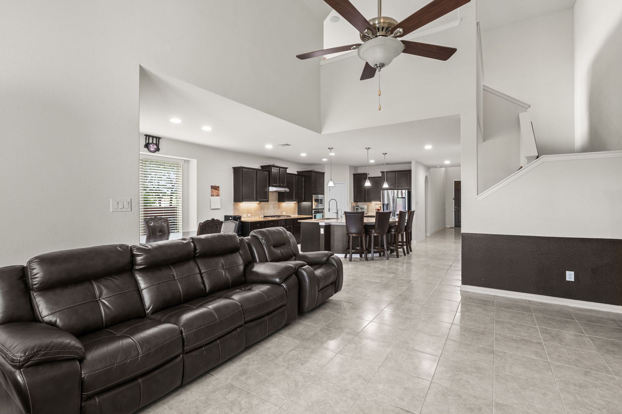 373 Rough Bark Street Buda, TX 78610 - Photo 10 of 39 A spacious layout connects the bright kitchen to the inviting living area.