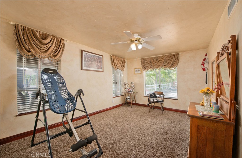 30602 Hasley Canyon Road Castaic, CA 91384 - Photo 22 of 72 a living room with furniture and a window