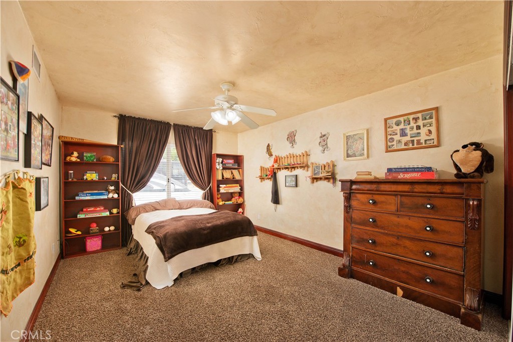 30602 Hasley Canyon Road Castaic, CA 91384 - Photo 25 of 72 a bedroom with a bed and a window