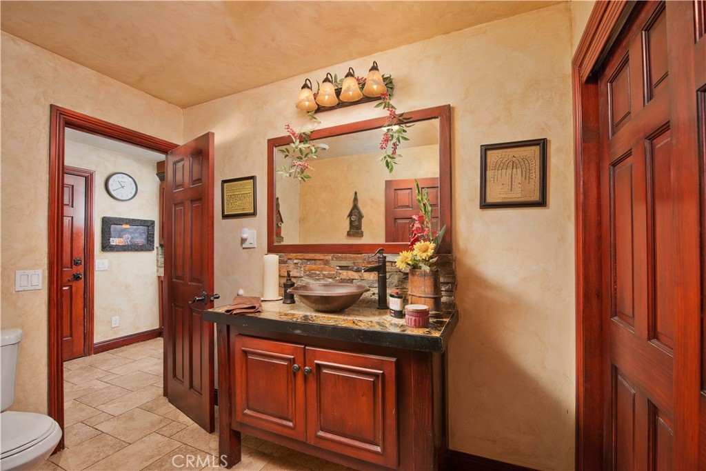 30602 Hasley Canyon Road Castaic, CA 91384 - Photo 29 of 72 a bathroom with a sink and a mirror