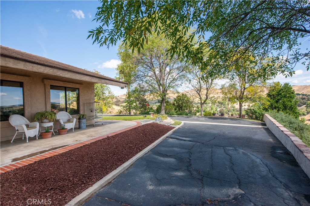 30602 Hasley Canyon Road Castaic, CA 91384 - Photo 34 of 72 a view of a house with porch and sitting area