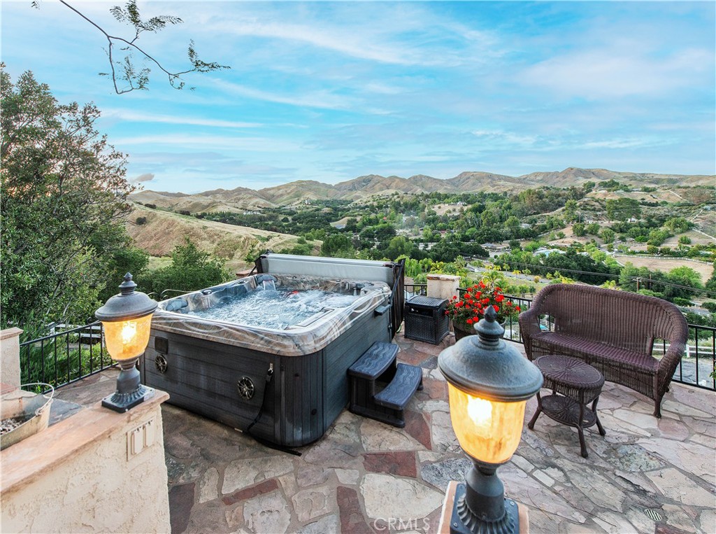 30602 Hasley Canyon Road Castaic, CA 91384 - Photo 35 of 72 a view of a terrace with furniture and a garden