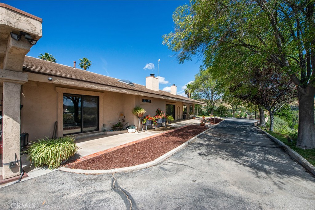 30602 Hasley Canyon Road Castaic, CA 91384 - Photo 39 of 72 a view of a house with a patio