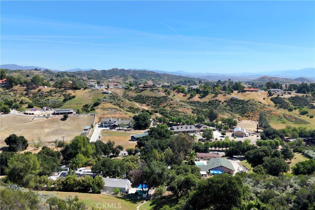 30602 Hasley Canyon Road Castaic, CA 91384 - Photo 44 of 72 an aerial view of a city with lots of residential buildings