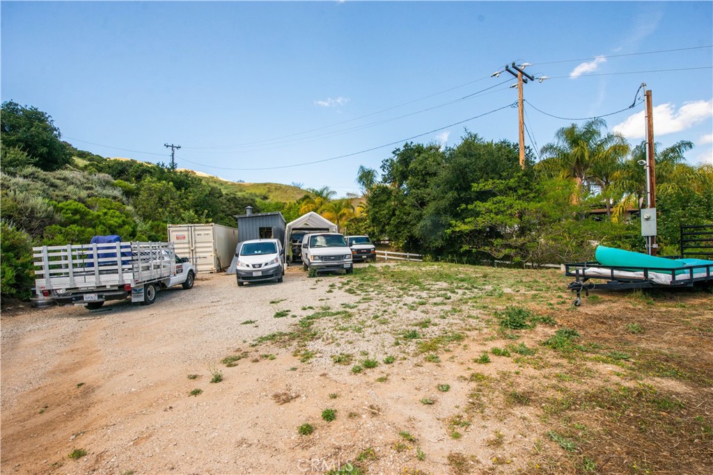 30602 Hasley Canyon Road Castaic, CA 91384 - Photo 52 of 72 a car parked in front of a house