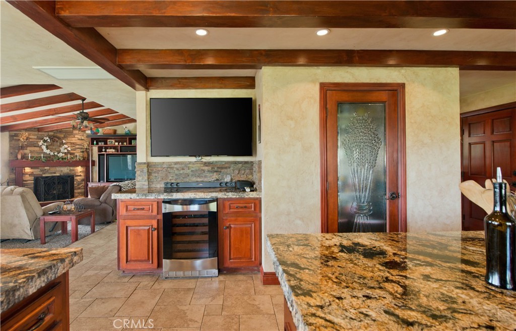 30602 Hasley Canyon Road Castaic, CA 91384 - Photo 9 of 72 a kitchen with stainless steel appliances kitchen island granite countertop a stove and a refrigerator