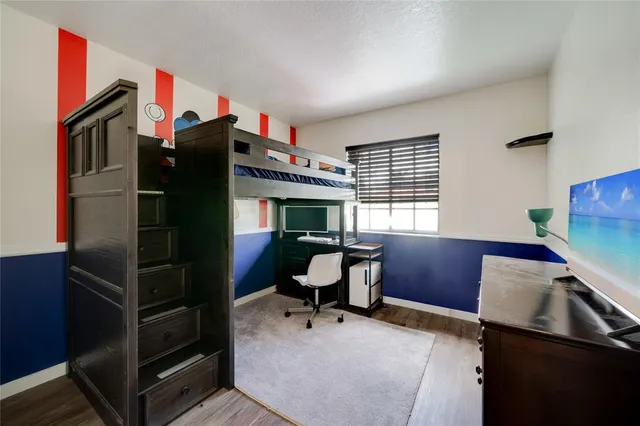 a workspace with furniture window and wooden floor