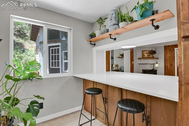 a view of kitchen with cabinets and wooden floor