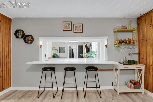 a kitchen with a table and chairs in it
