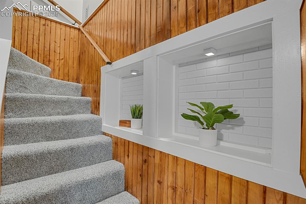 4540 Fountain Avenue Cascade, CO 80809 - Photo 28 of 50 a view of staircase with wooden floor