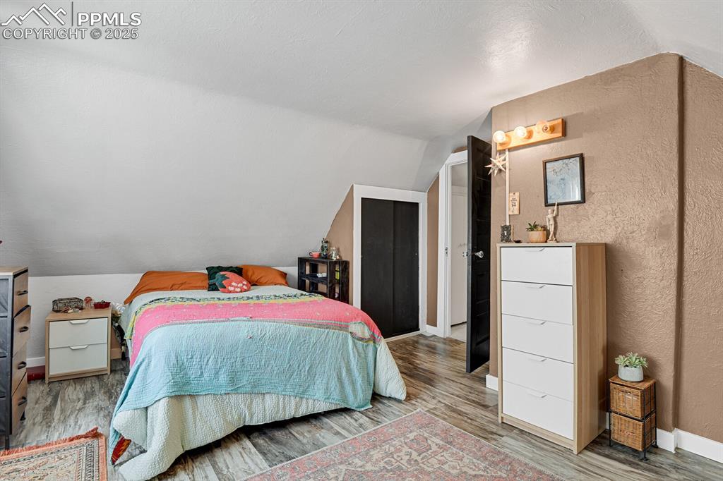 4540 Fountain Avenue Cascade, CO 80809 - Photo 29 of 50 a bedroom with a bed and a refrigerator