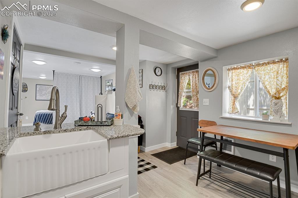 4540 Fountain Avenue Cascade, CO 80809 - Photo 37 of 50 a bathroom with a sink a large mirror and a window