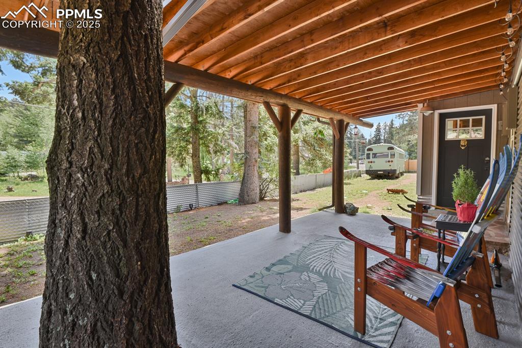 4540 Fountain Avenue Cascade, CO 80809 - Photo 45 of 50 a patio with table and chairs