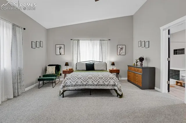 a bedroom with bed and window