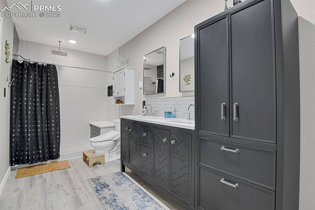 4540 Fountain Avenue Cascade, CO 80809 - Photo 10 of 50 a bathroom with a sink a toilet and shower