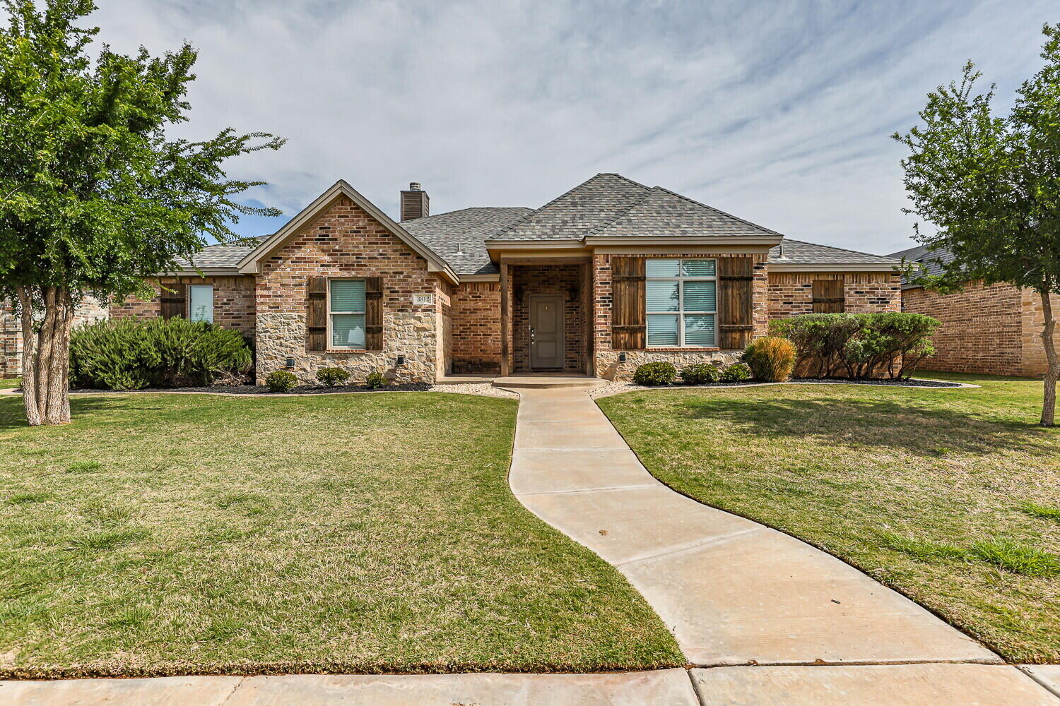 3812 135th Street Lubbock, TX 79423 - Photo 1 of 41 front view of a house with a yard