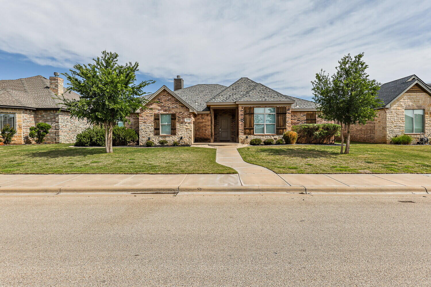 3812 135th Street Lubbock, TX 79423 - Photo 2 of 41 a front view of a house with a yard