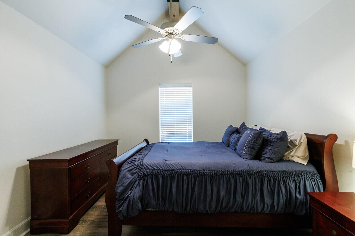 3812 135th Street Lubbock, TX 79423 - Photo 23 of 41 a bedroom with a bed and a ceiling fan