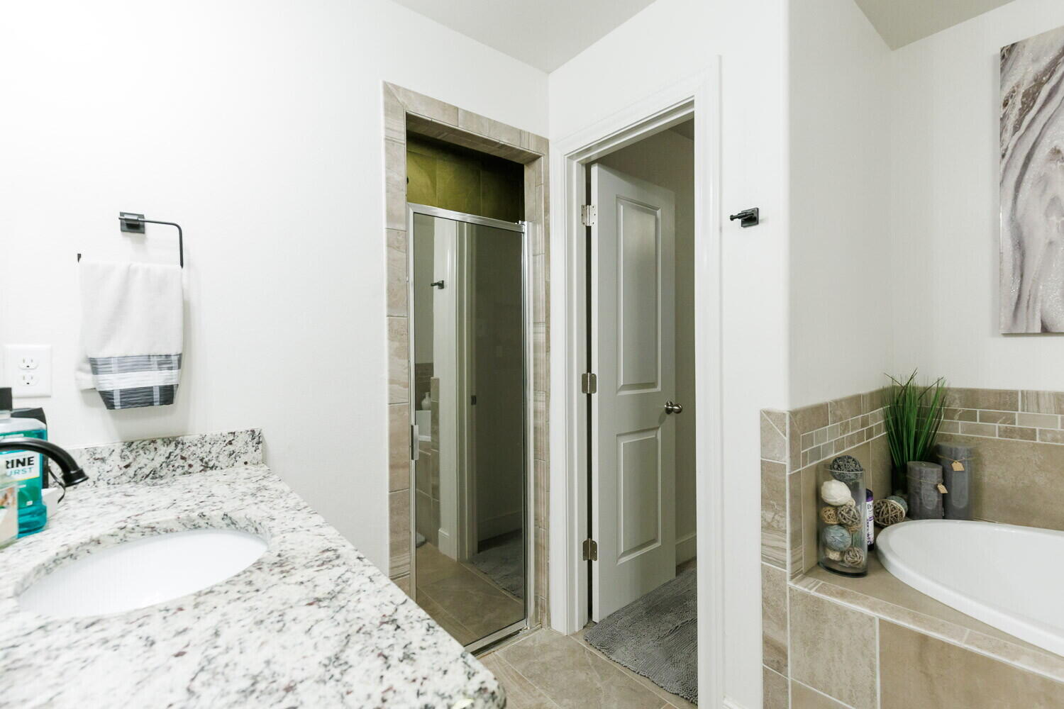 3812 135th Street Lubbock, TX 79423 - Photo 34 of 41 a bathroom with a tub sink and shower