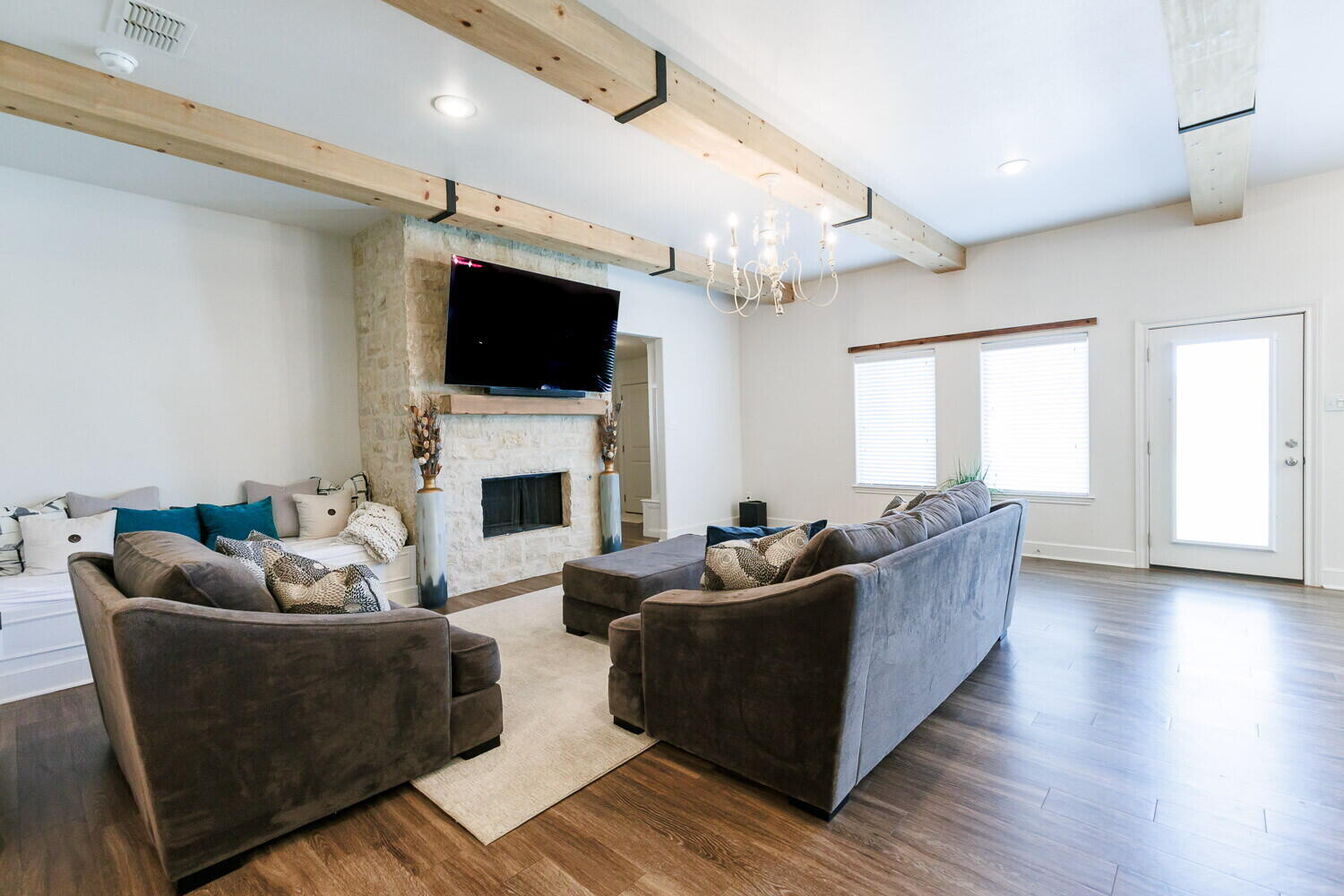 3812 135th Street Lubbock, TX 79423 - Photo 5 of 41 a living room with furniture a flat screen tv and a fireplace