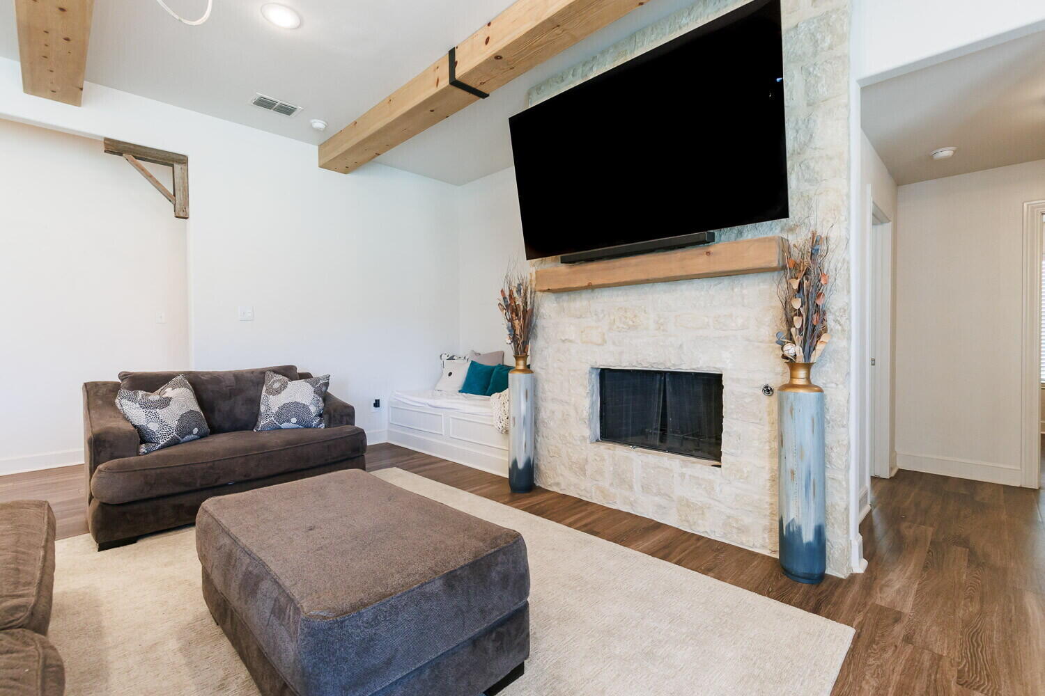3812 135th Street Lubbock, TX 79423 - Photo 6 of 41 a living room with furniture a flat screen tv and a fireplace