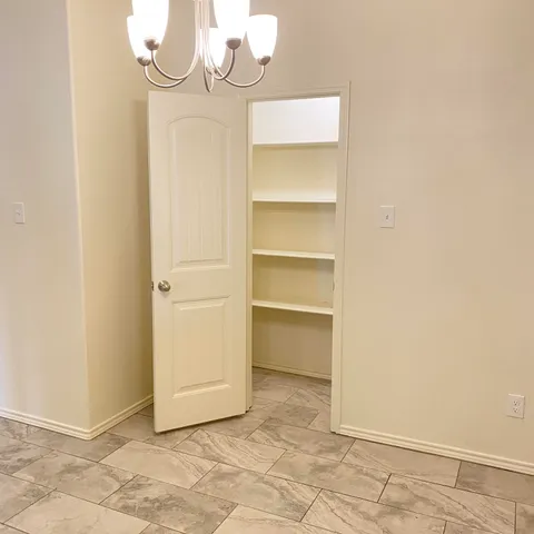 a view of a room with rack on the wall