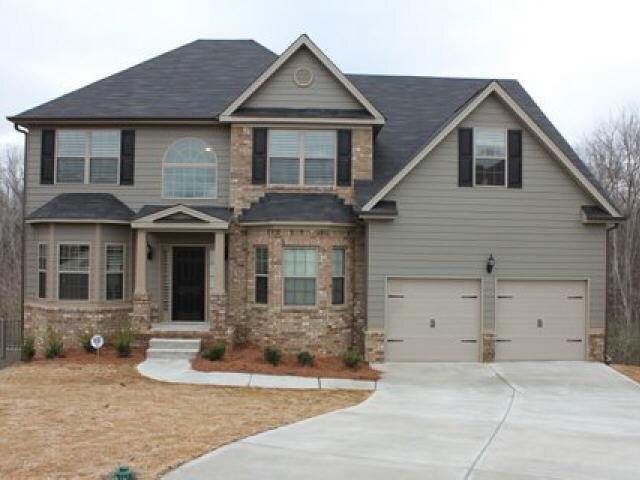 757 Carter Road Jonesboro, GA 30238 - Photo 1 of 1 a front view of a house with a yard and garage