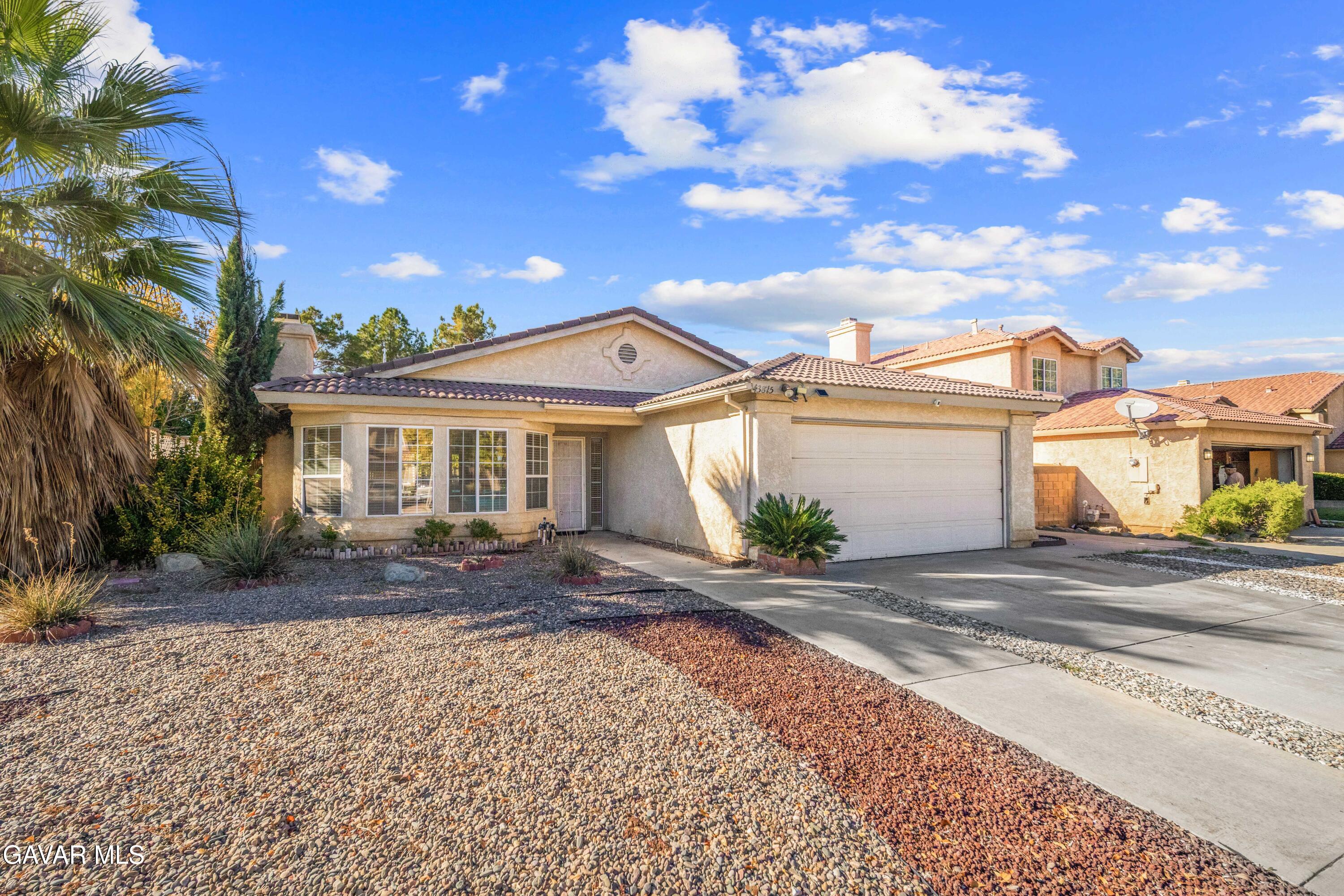 43815 Silver Bow Road Lancaster, CA 93535 - Photo 2 of 20 a view of a house with a patio