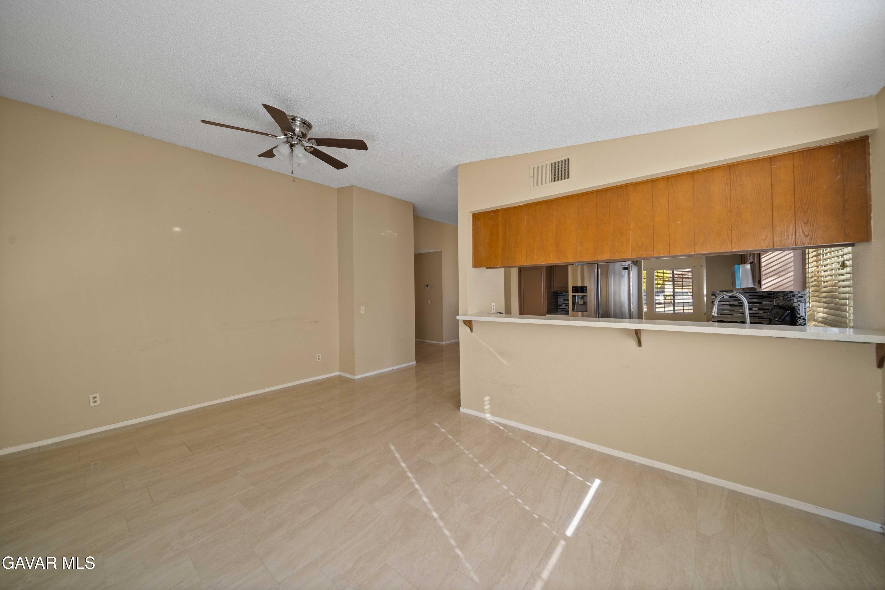 43815 Silver Bow Road Lancaster, CA 93535 - Photo 10 of 20 a view of room with window and a ceiling fan