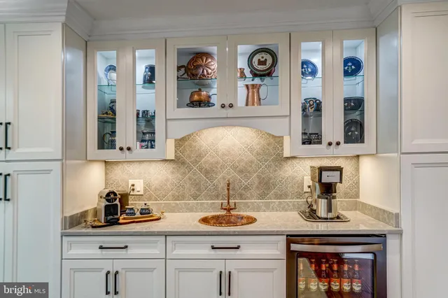 a kitchen with cabinets and window