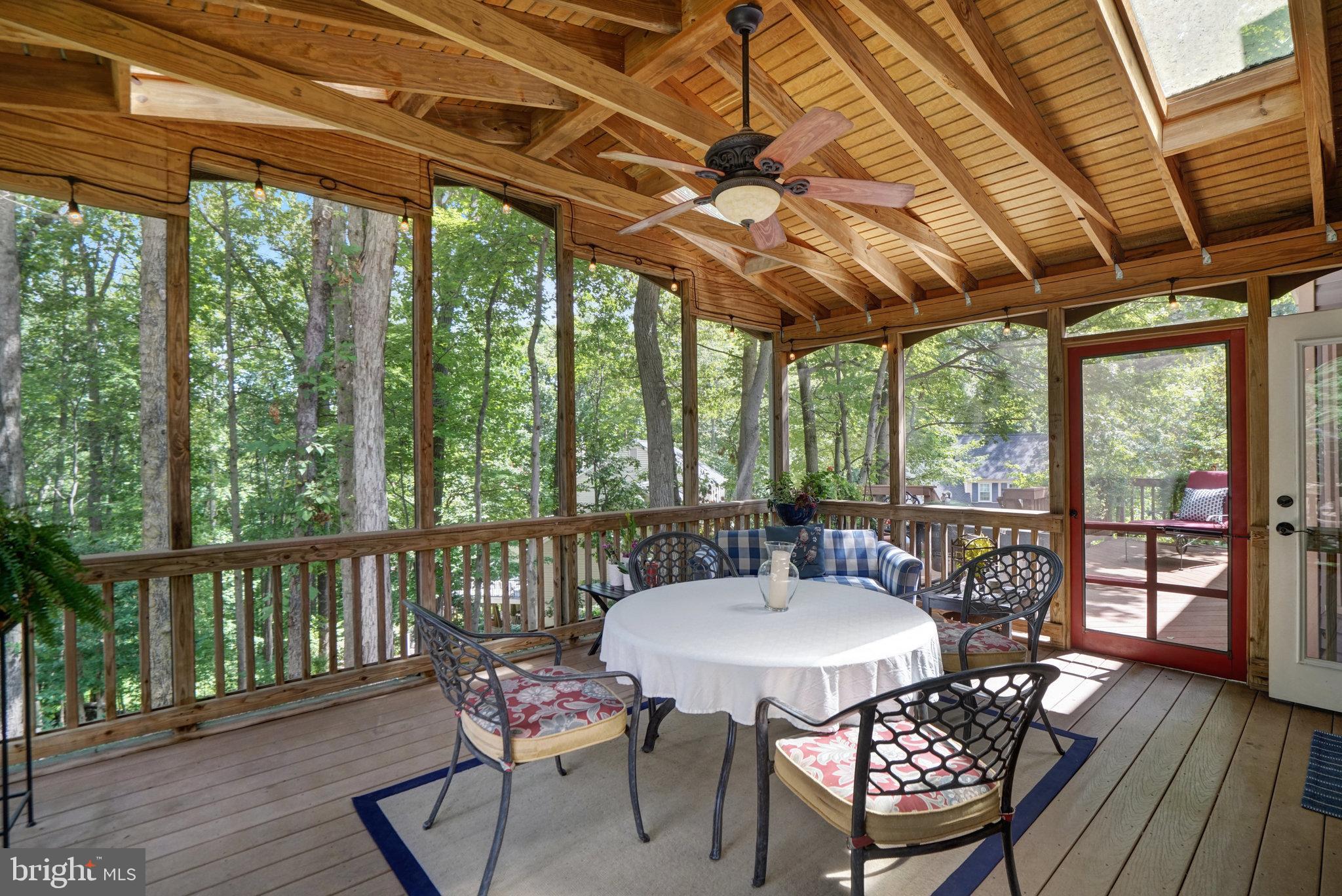 6815 Bluecurl Circle Springfield, VA 22152 - Photo 16 of 49 a view of a outdoor space with table and chairs