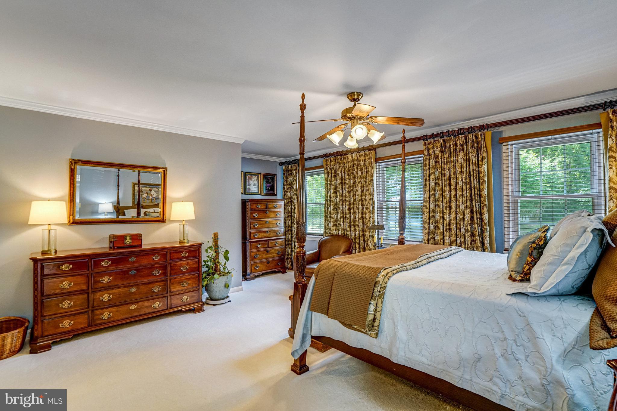 6815 Bluecurl Circle Springfield, VA 22152 - Photo 21 of 49 a bedroom with a bed mirror and window