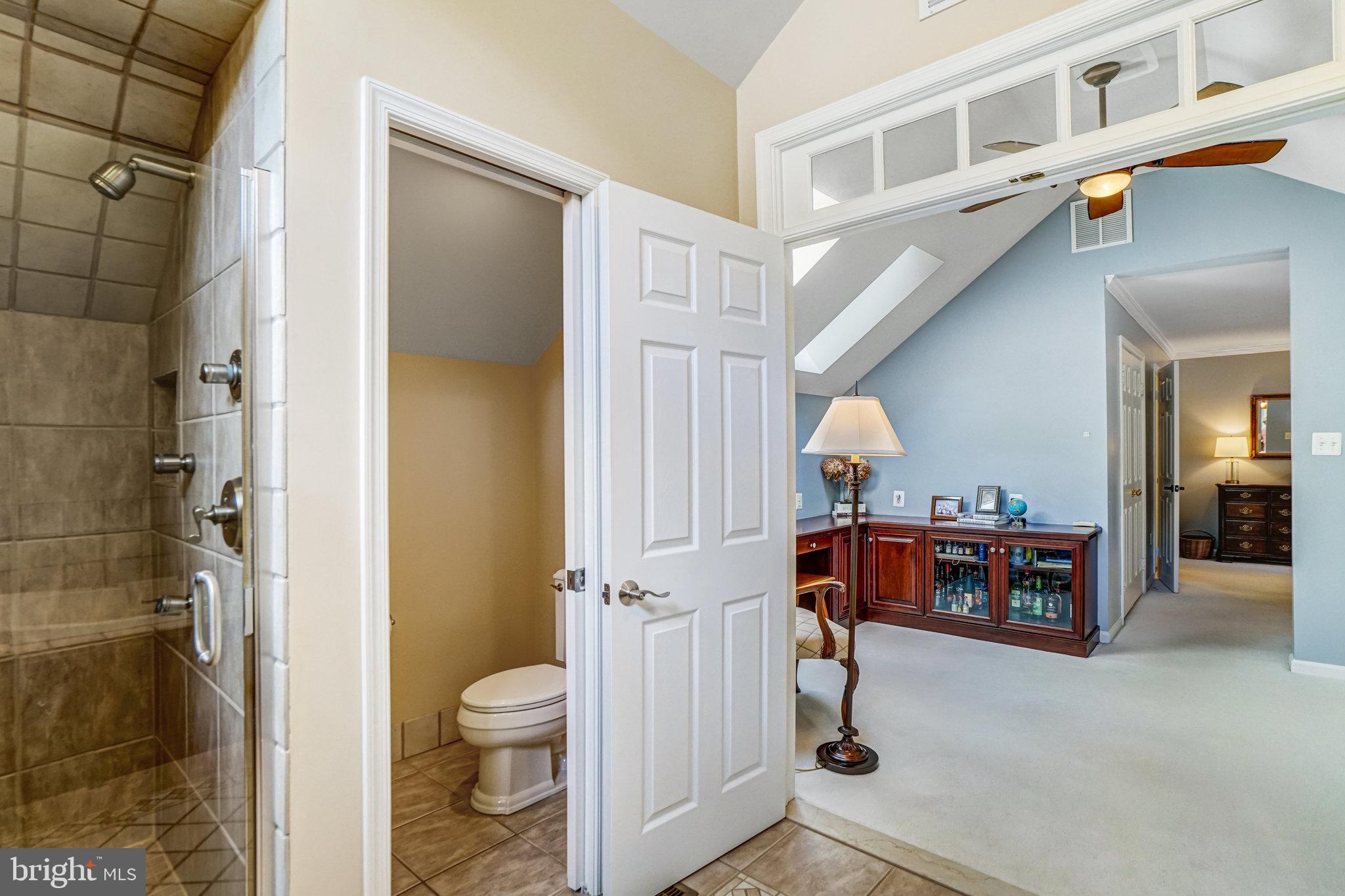 6815 Bluecurl Circle Springfield, VA 22152 - Photo 25 of 49 a view of a hallway with bathroom and shower