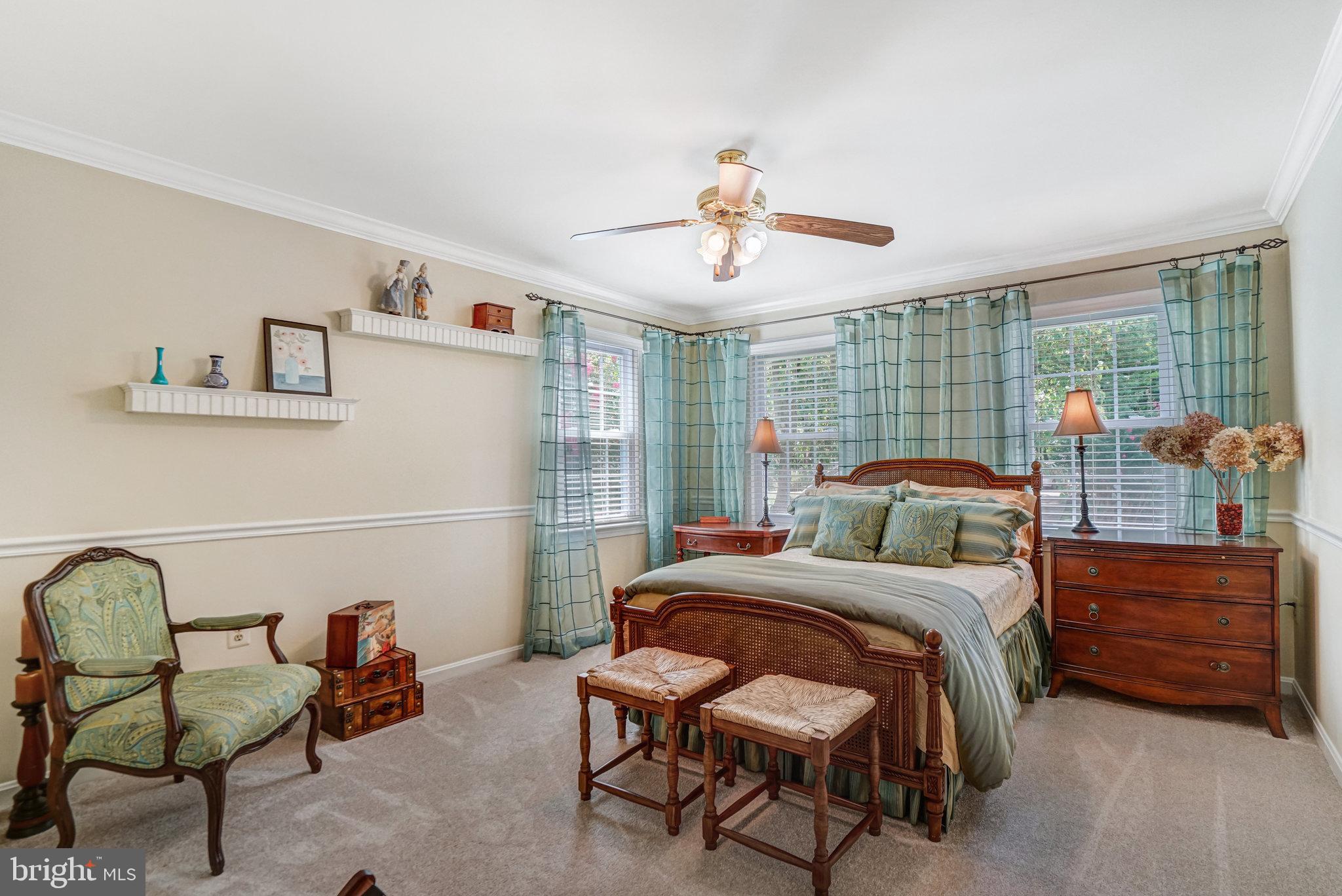 6815 Bluecurl Circle Springfield, VA 22152 - Photo 27 of 49 a bedroom with a bed a lamp and a window
