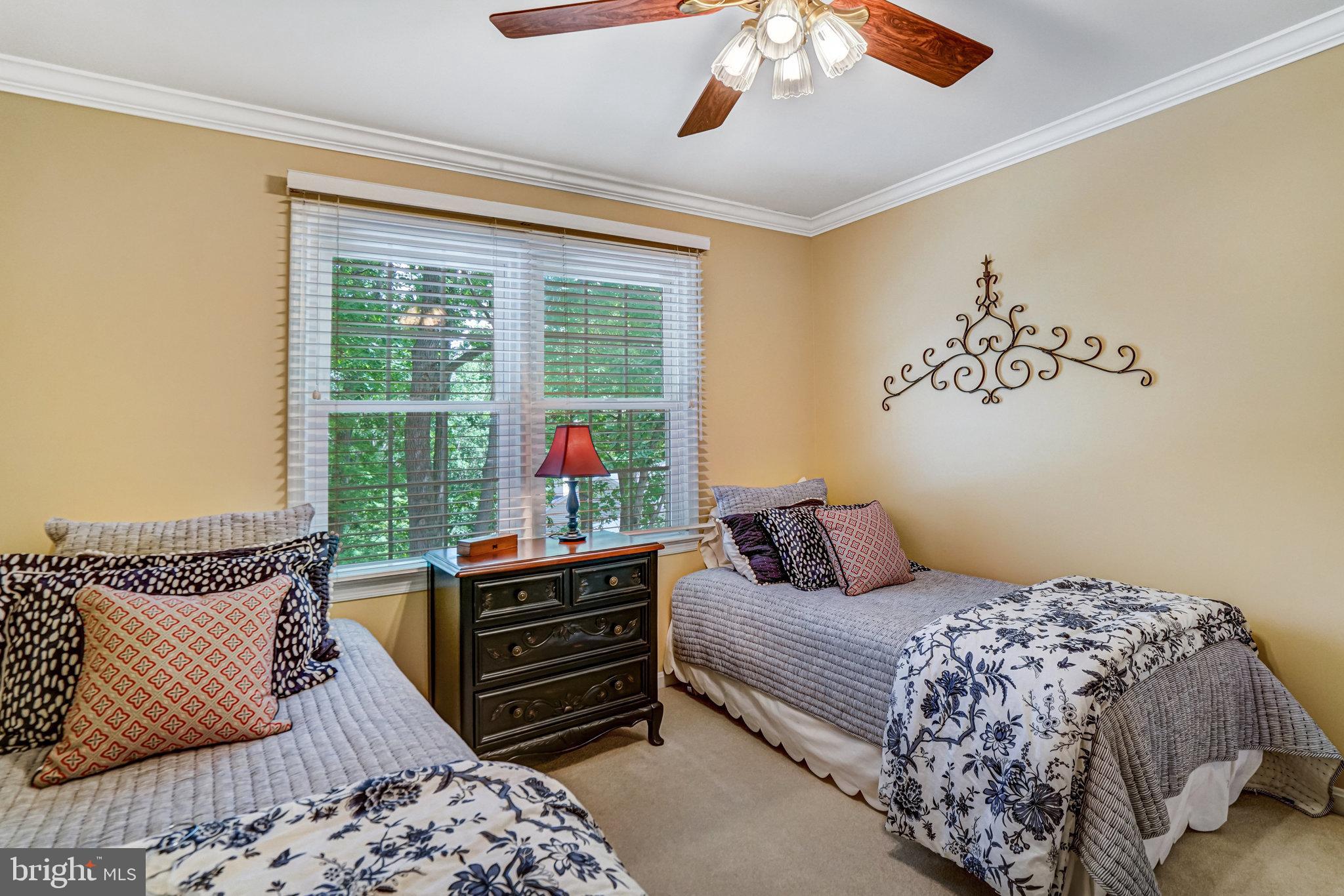 6815 Bluecurl Circle Springfield, VA 22152 - Photo 28 of 49 a bedroom with a bed and wooden floor
