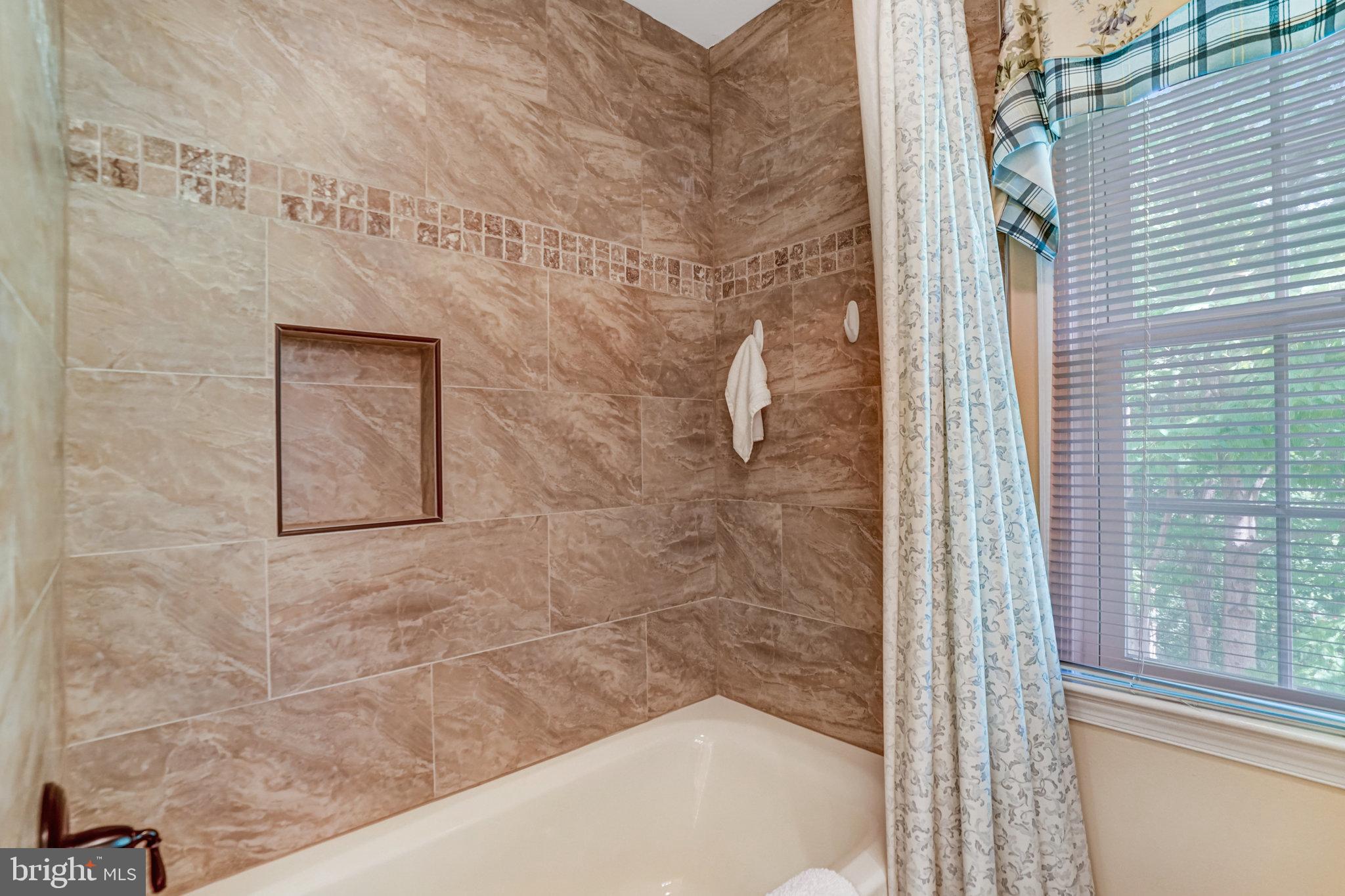 6815 Bluecurl Circle Springfield, VA 22152 - Photo 31 of 49 a bathroom with a bathtub