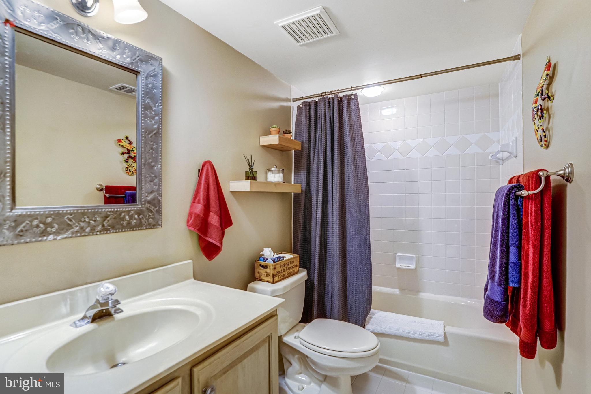 6815 Bluecurl Circle Springfield, VA 22152 - Photo 36 of 49 a bathroom with a sink toilet and shower