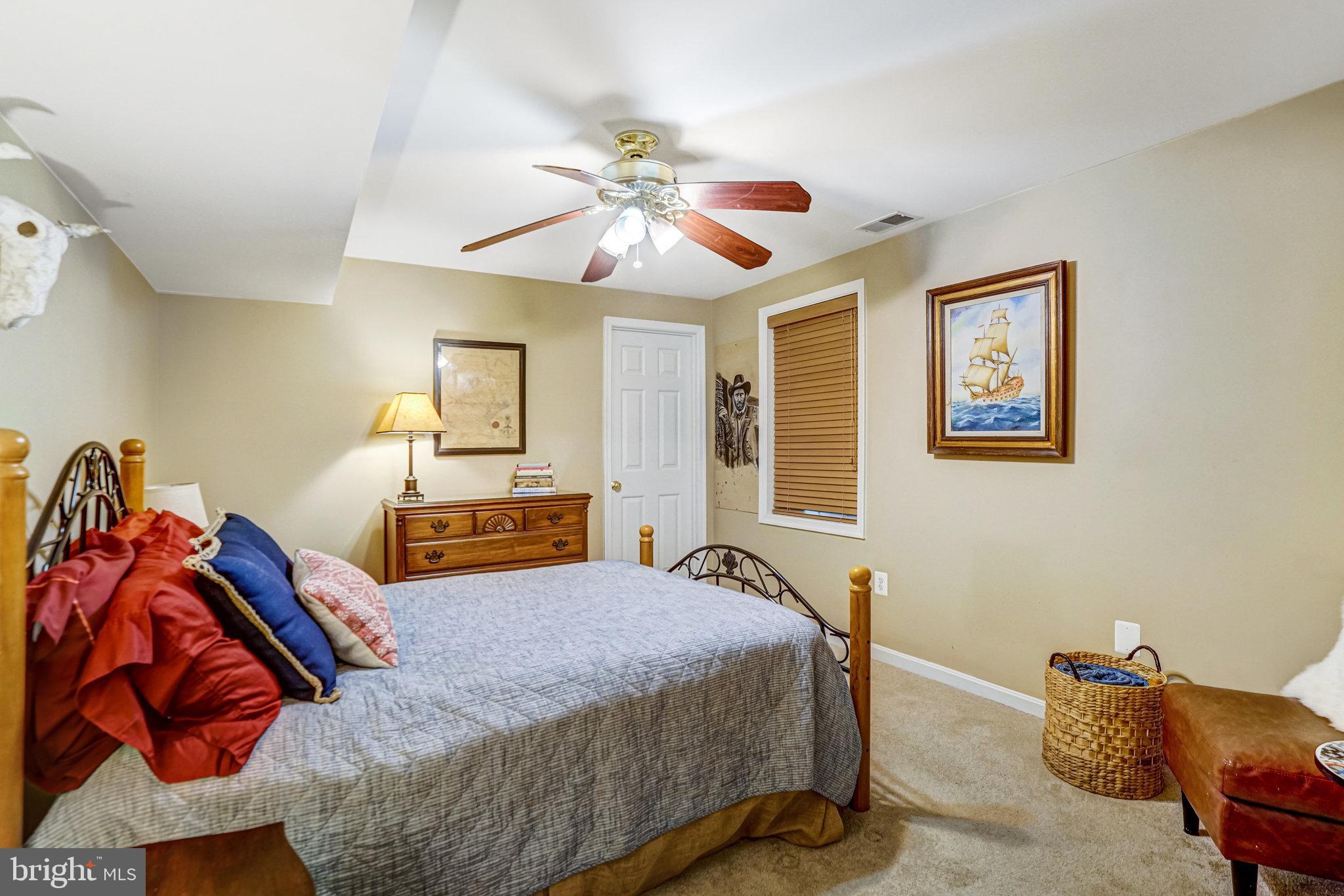 6815 Bluecurl Circle Springfield, VA 22152 - Photo 39 of 49 a bedroom with a bed and closet