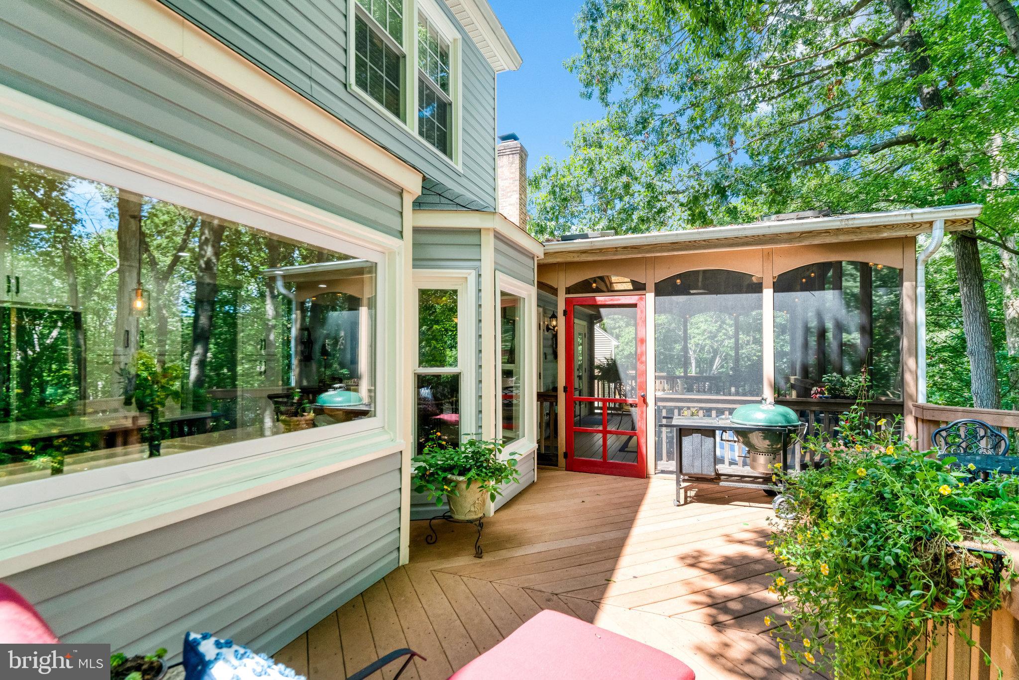 6815 Bluecurl Circle Springfield, VA 22152 - Photo 40 of 49 a view of a house with sitting area and garden