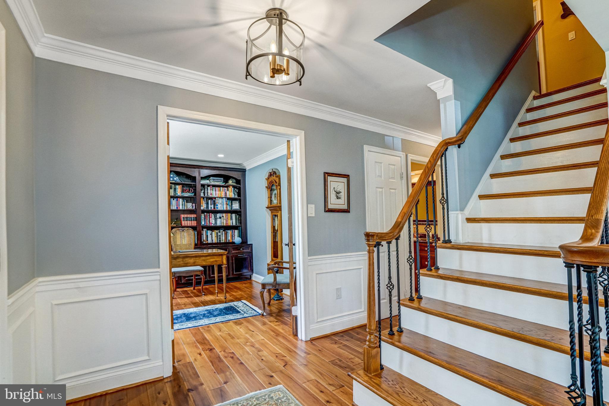 6815 Bluecurl Circle Springfield, VA 22152 - Photo 4 of 49 a view of a livingroom with furniture and staircase