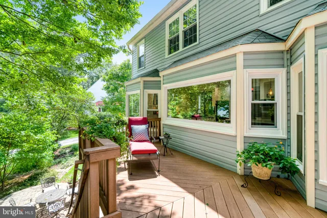 a view of a chair and tables in the backyard of the house
