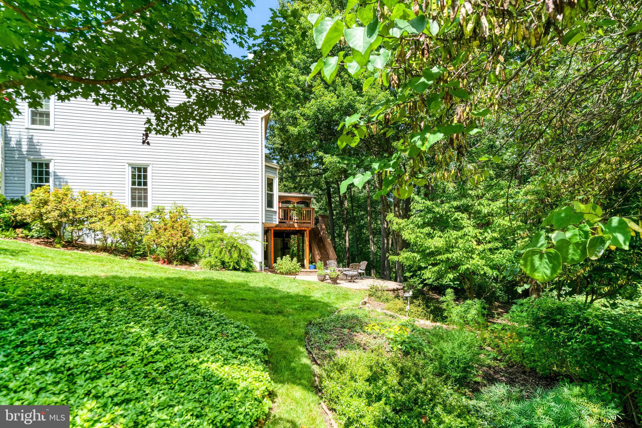 6815 Bluecurl Circle Springfield, VA 22152 - Photo 45 of 49 a view of a house with a yard