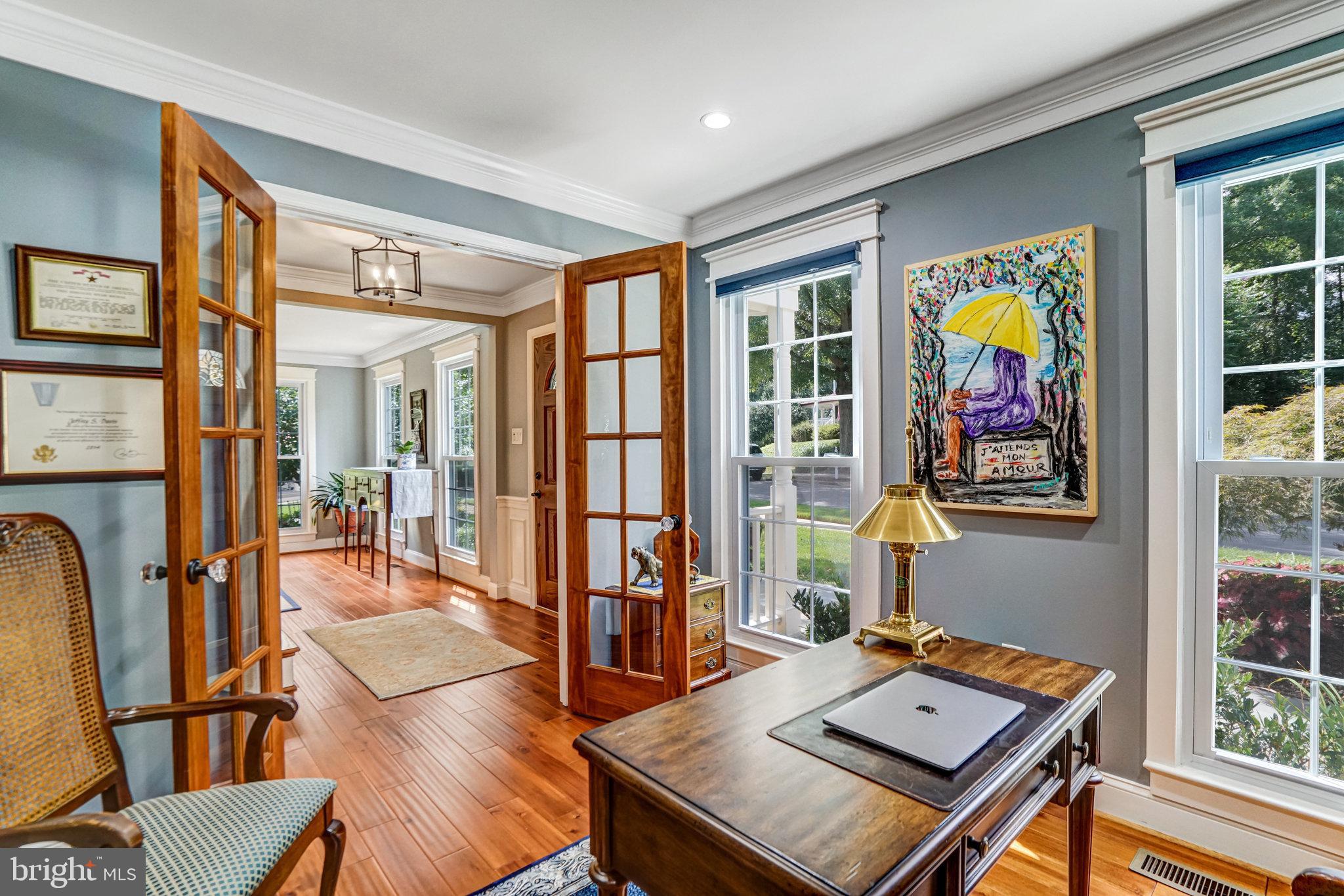 6815 Bluecurl Circle Springfield, VA 22152 - Photo 5 of 49 a living room with furniture and floor to ceiling windows