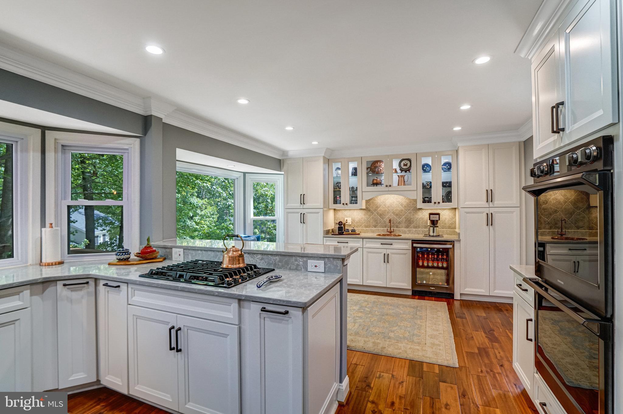 6815 Bluecurl Circle Springfield, VA 22152 - Photo 10 of 49 a kitchen with sink a stove and refrigerator